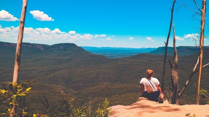 A tourist enjoying views over the Blue Mountains, NSW, for their Queen's Birthday Weekend getaways