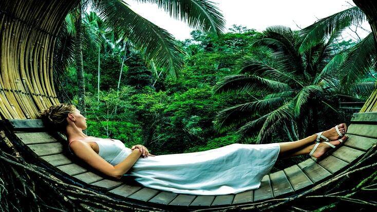 woman relaxing in the rainforest , celebrate World Environment Day