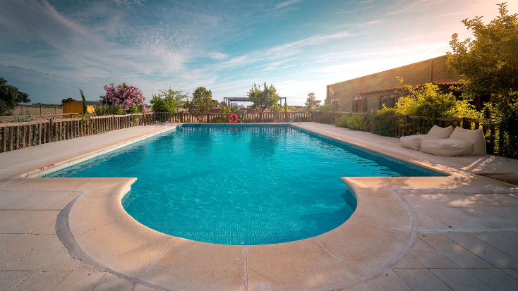 Tranquil pool area for guests staying at Glamping Hub’s Host of the Month for August 2021 luxury domes.