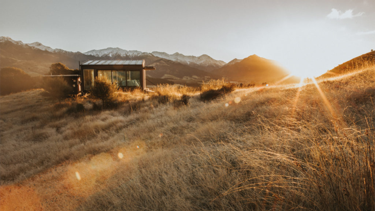 A New Zealand accommodation alone in a field at night.