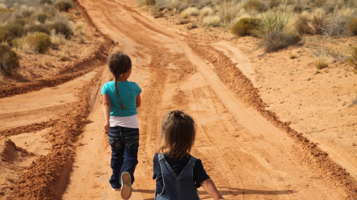 Children enjoying Navajo lands at Arizona glamping resort.