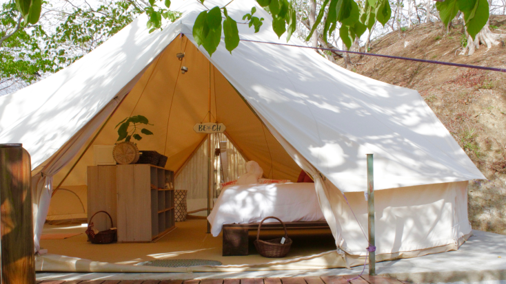 Queen bed at bell tent, glamping resort in  Guanacaste, Costa Rica