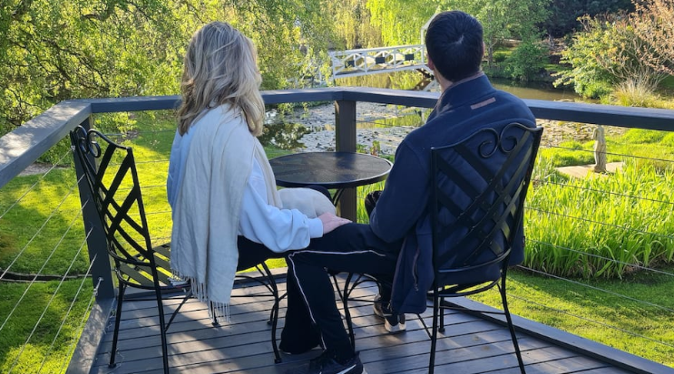 Guests enjoying beautiful garden at glamping site. Winner of Glamping Hub's Host of the Month for April 2022 - Sally and Rex in Tasmania, Australia