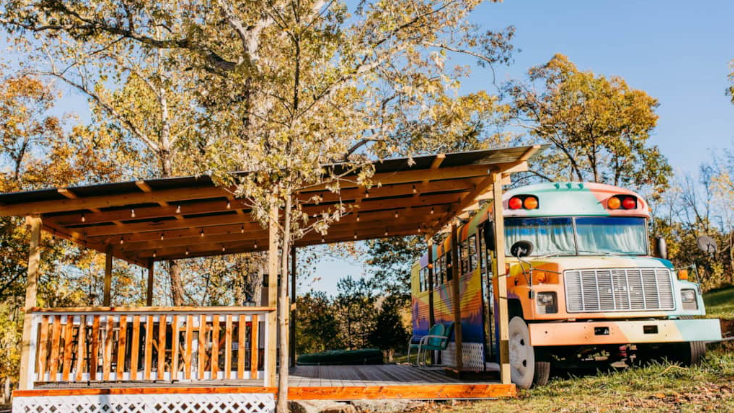 Renovated multicolored bus at glamping retreat in Missouri