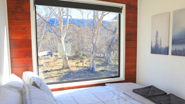 Enjoy wildlife and gum trees from stunning oversized windows in this off-grid tiny home in NSW, Australia