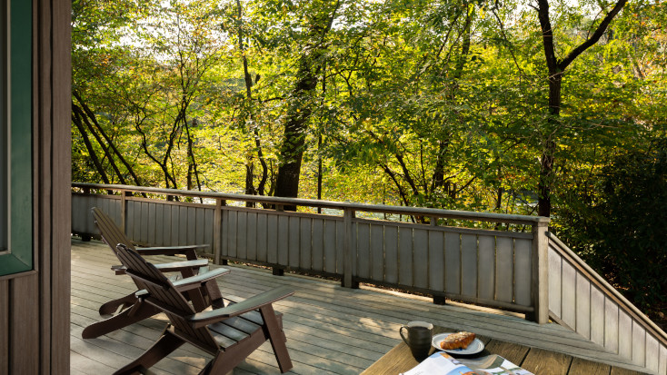 Large deck with deck chairs and river view in PA