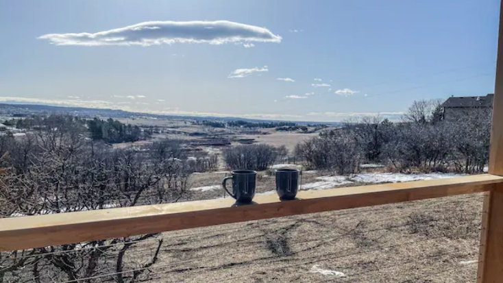 view of the colorado countryside from the deck of a tiny home