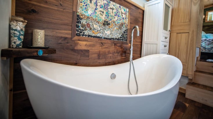 luxury deep bathtub in tiny house at  glamping site in Georgia
