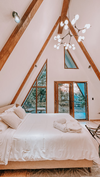 Bedroom in the A-frame from our host of the month