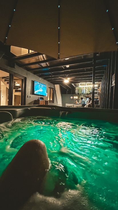 hot tub and outdoor living space at night