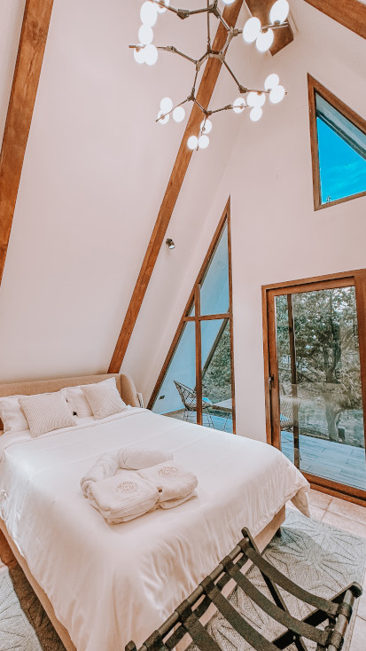 luxury bedroom in a-frame glamping getaway